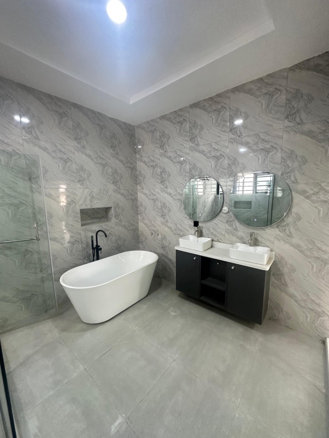 Luxury bathroom with tub and double vanity